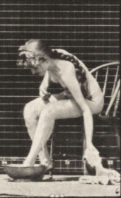 Plate 411 Lifting a towel while sitting and wiping feet — figure reference